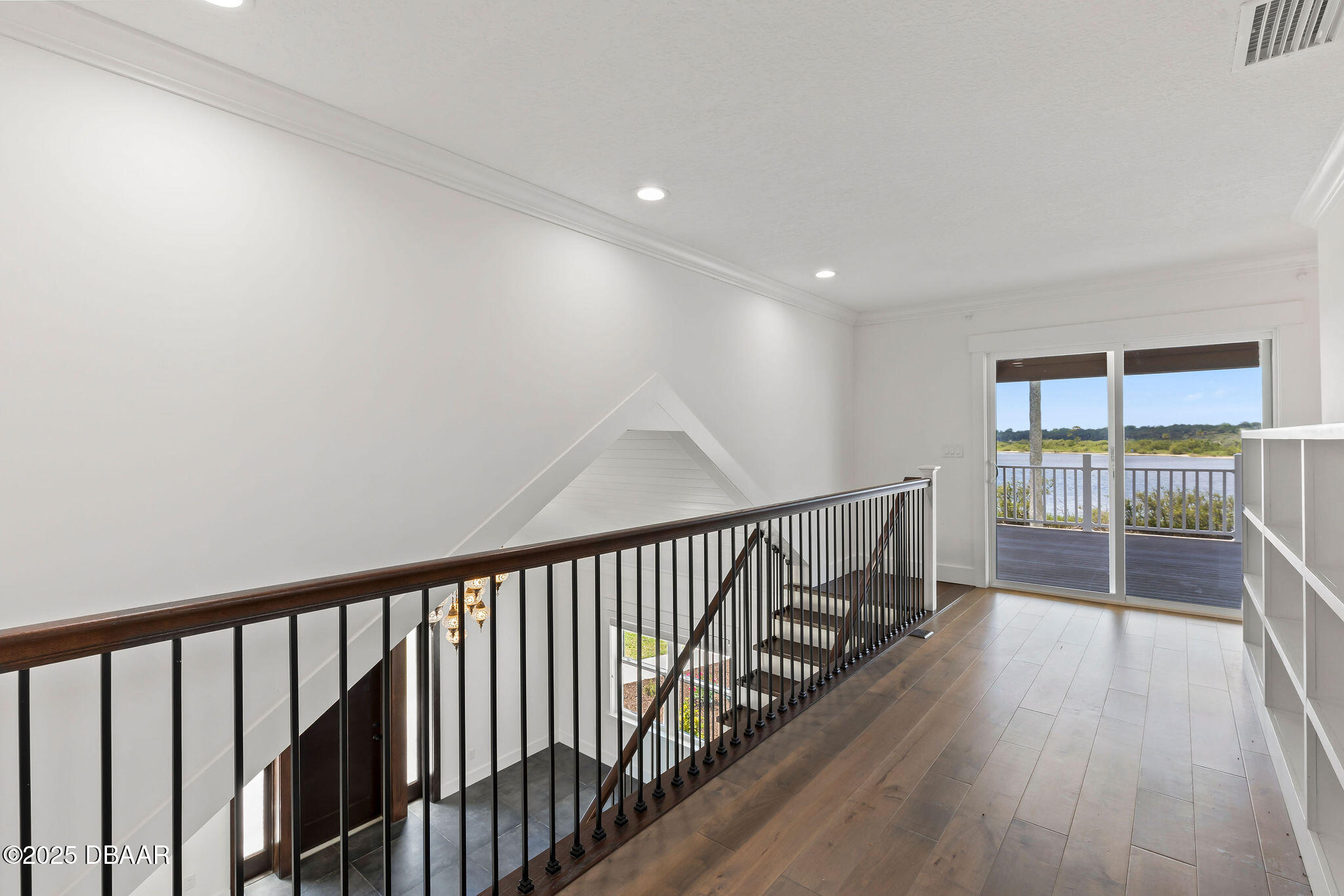 604 Springdale Drive Flagler Beach, FL 32136 - Photo 36 of 78 a view of a hallway with wooden floor and windows