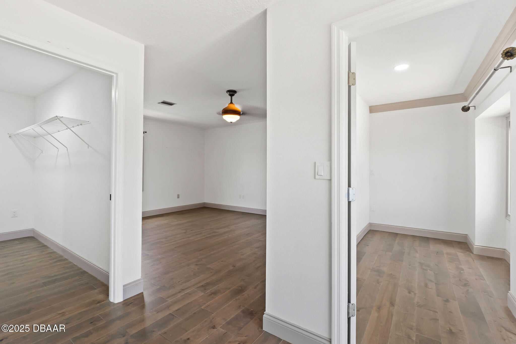 604 Springdale Drive Flagler Beach, FL 32136 - Photo 48 of 78 an empty room with wooden floor and windows
