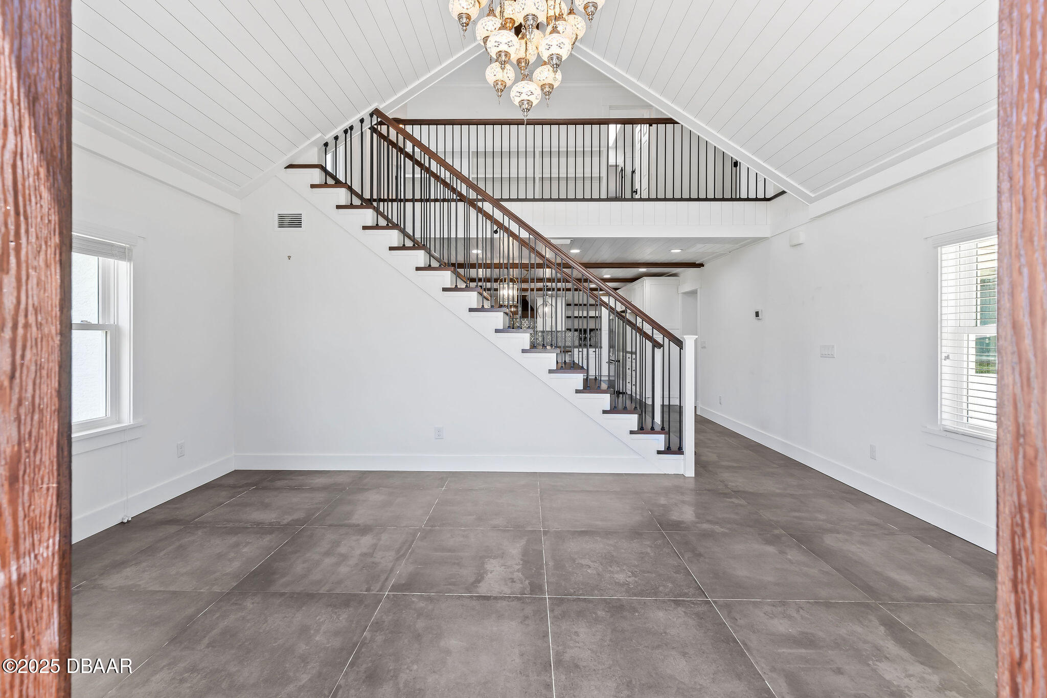 604 Springdale Drive Flagler Beach, FL 32136 - Photo 6 of 78 a view of entryway and hall with a window