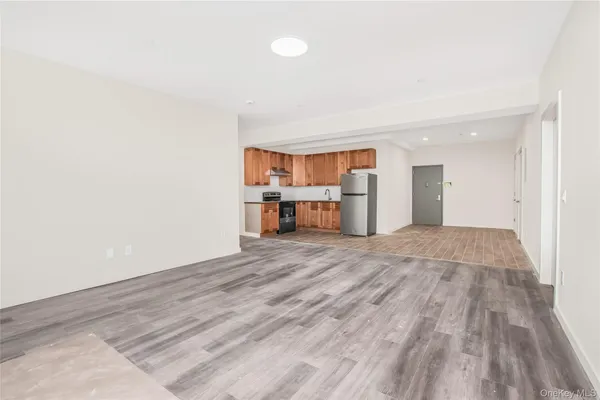 a view of a room with a sink and a refrigerator