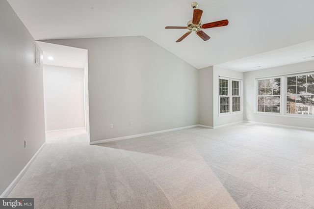 a spacious bathroom with a large tub shower and sink