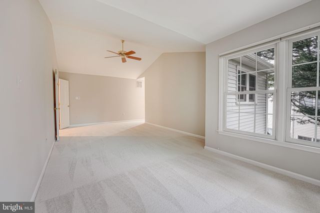 a view of empty room with a ceiling fan