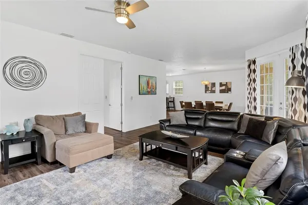 a living room with furniture and a rug