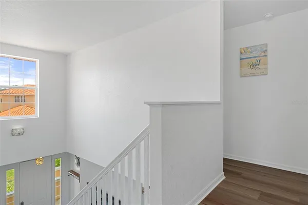 a view of an entryway with wooden floor
