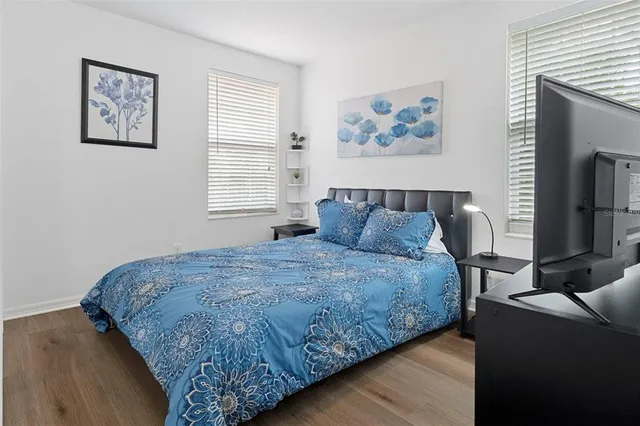 a bedroom with bed and a window