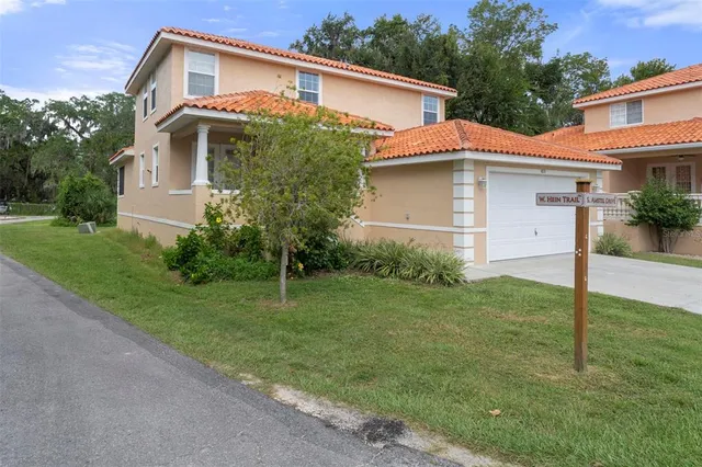 a front view of a house with a yard