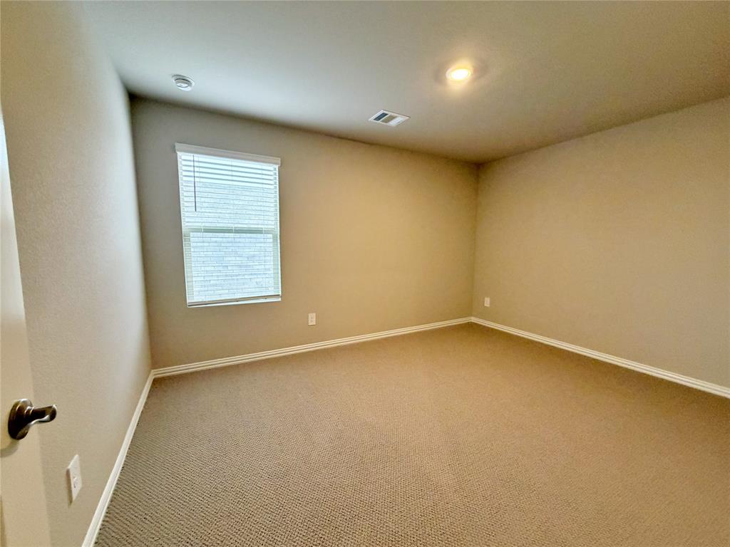 769 Poppy Lane Lavon, TX 75166 - Photo 22 of 32 an empty room with a window