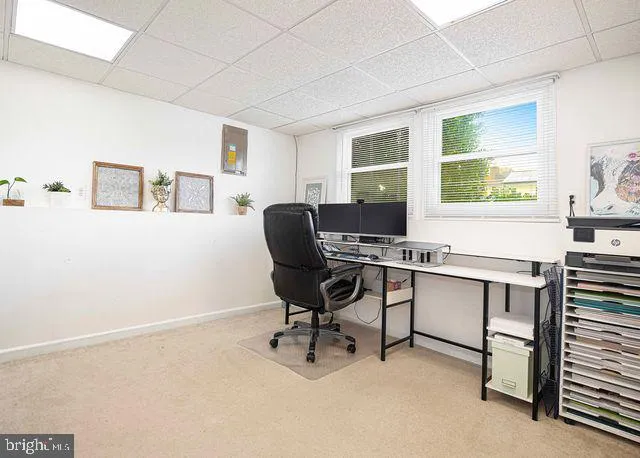 a bathroom with a toilet a sink and a mirror