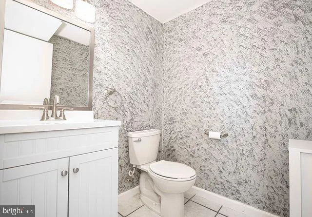 a bathroom with a sink a vanity and a mirror