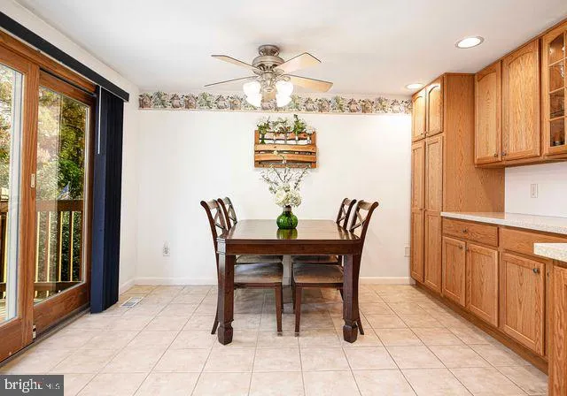 a kitchen with granite countertop a sink cabinets and window