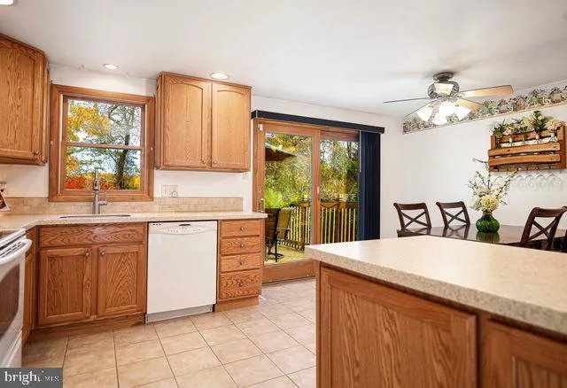 a kitchen with a stove sink and a refrigerator