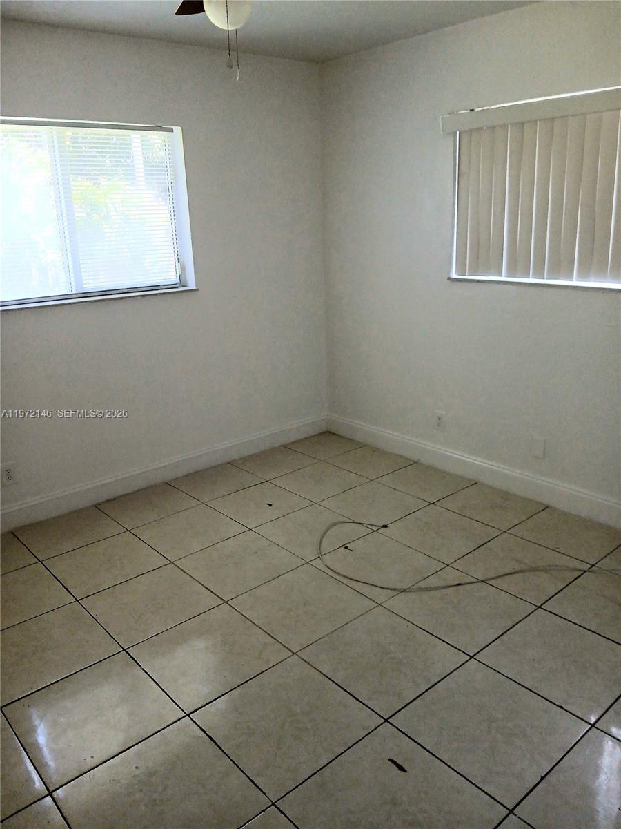 6471 Southwest 27th Street, Unit 2 Miramar, FL 33023 - Photo 33 of 41 an empty room with a window