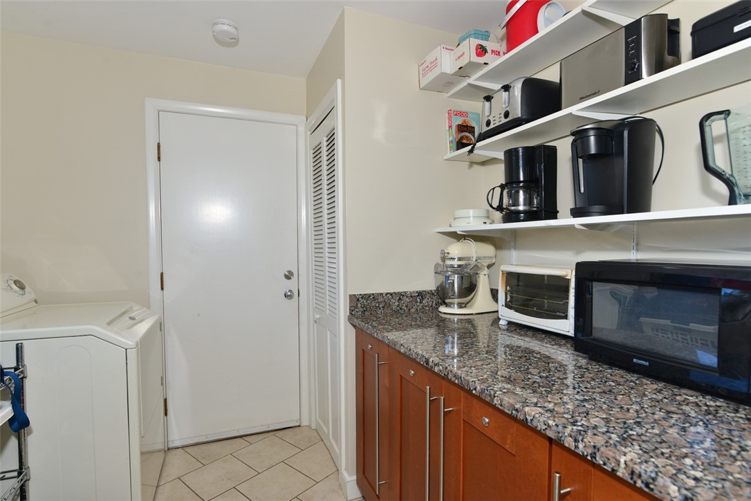 55 West Main Road Little Compton, RI 02837 - Photo 16 of 35 view from the Kitchen into the Pantry with laundry that leads to garage.