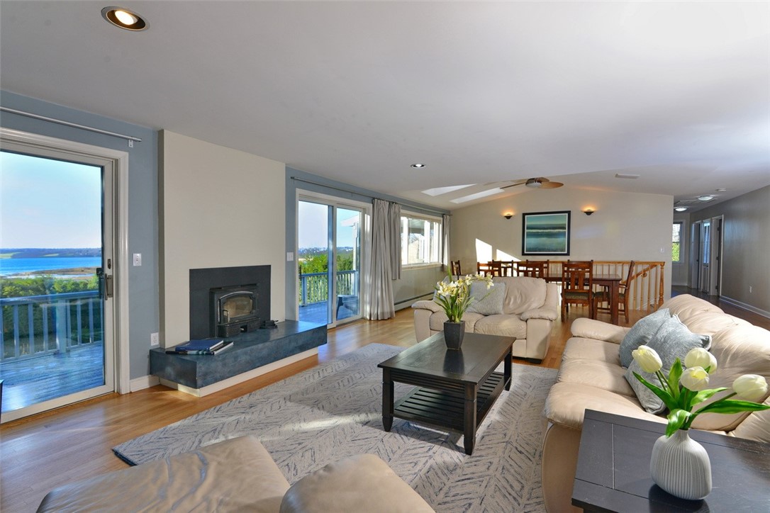 55 West Main Road Little Compton, RI 02837 - Photo 10 of 35 Double sliding glass doors lead to full length of house deck.