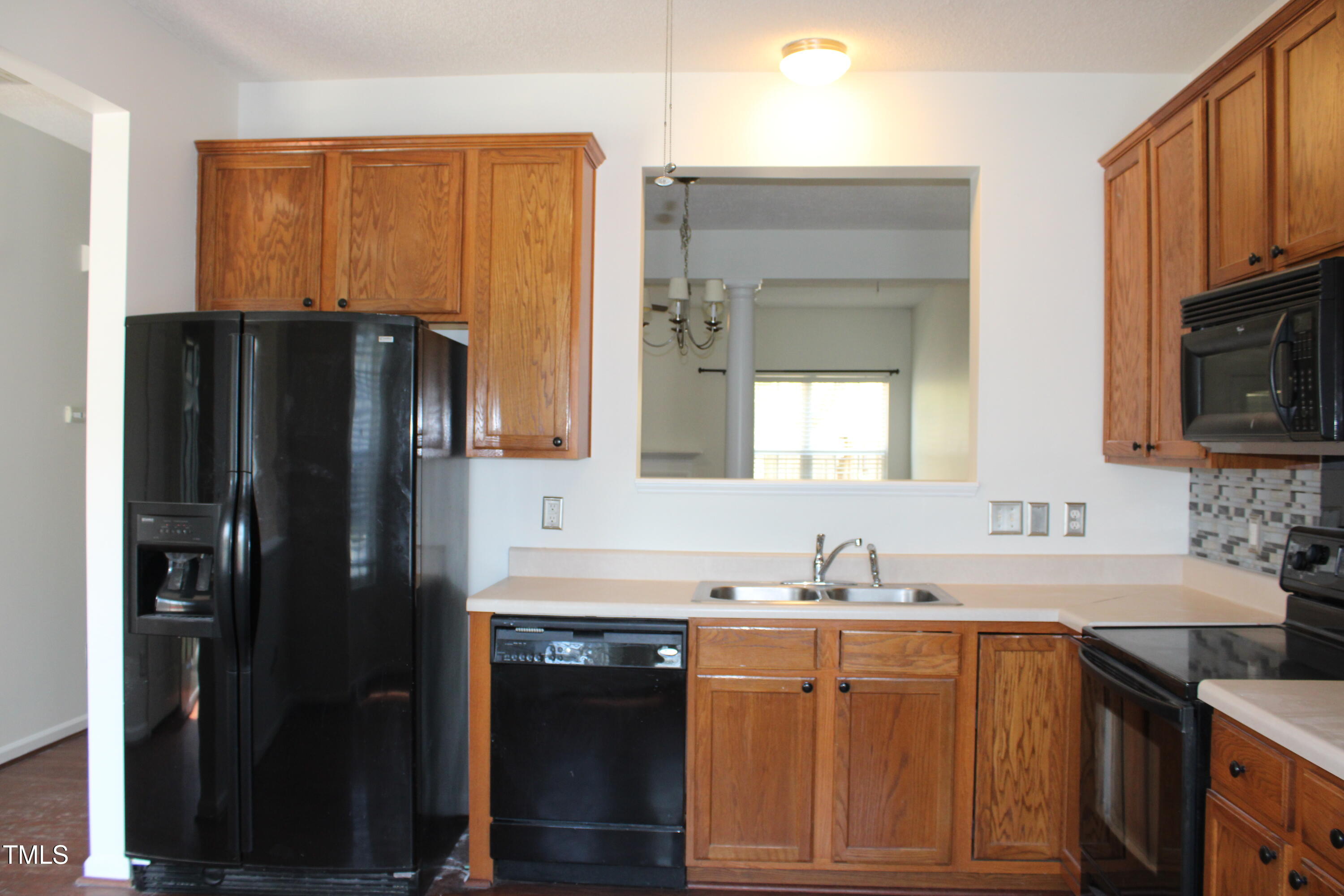 2802 Gross Avenue Wake Forest, NC 27587 - Photo 3 of 20 a kitchen with stainless steel appliances granite countertop a refrigerator and a sink