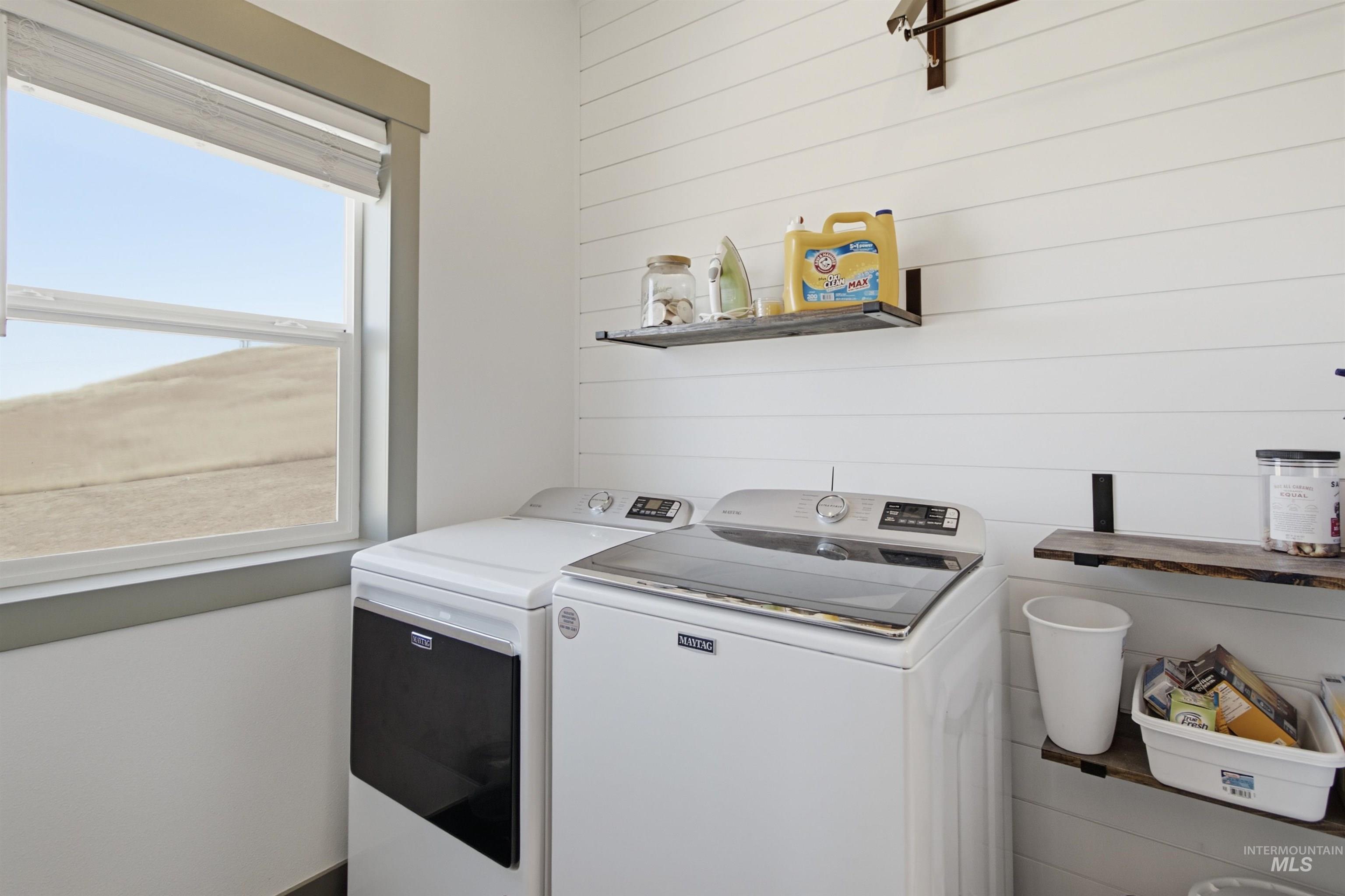 1032 Duffield Flat Road Potlatch, ID 83855 - Photo 15 of 50 Laundry area featuring a window, shiplap wall, and two built-in wall shelves