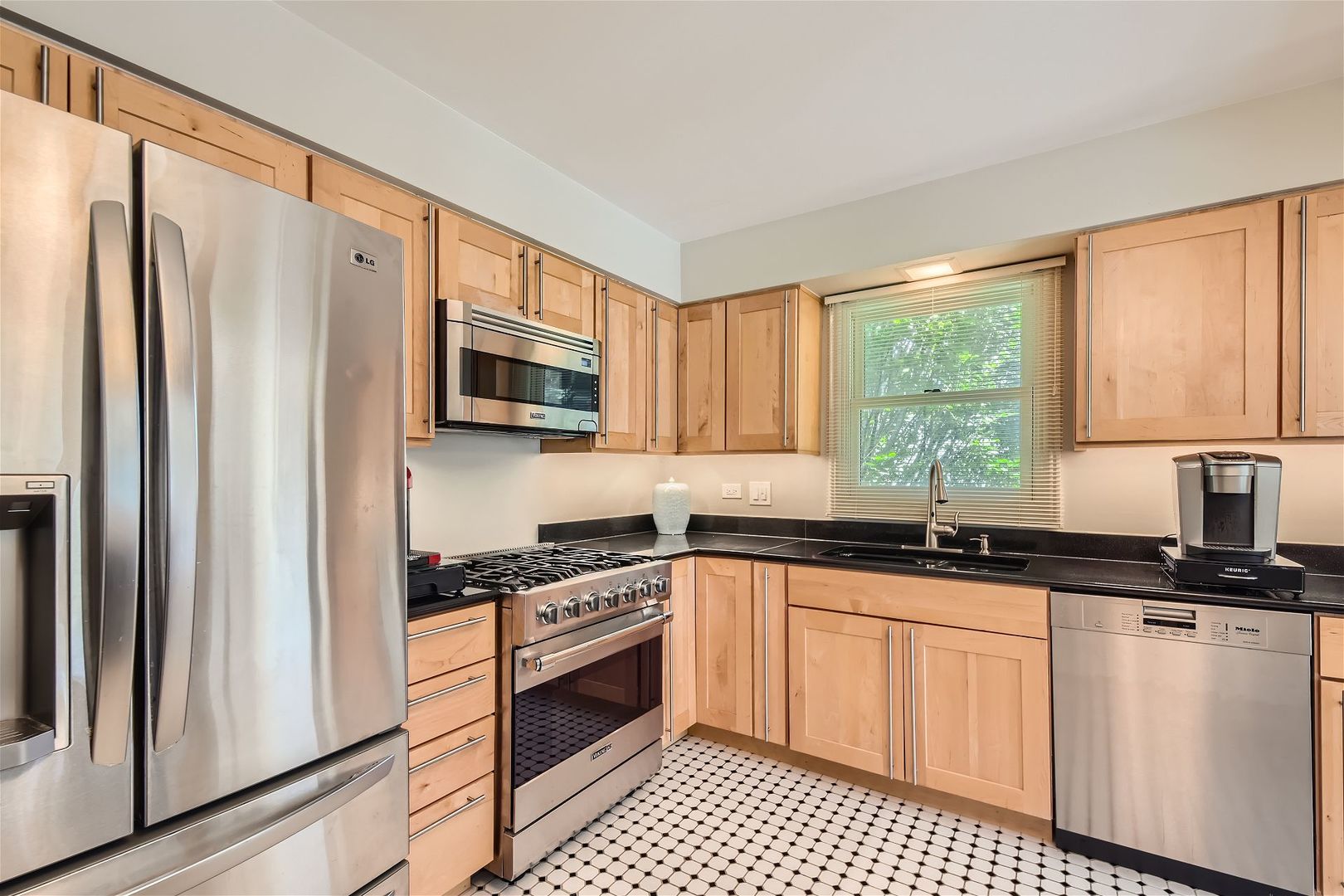1365 Freeman Road Hoffman Estates, IL 60192 - Photo 12 of 49 a kitchen with granite countertop a refrigerator stove top oven and sink