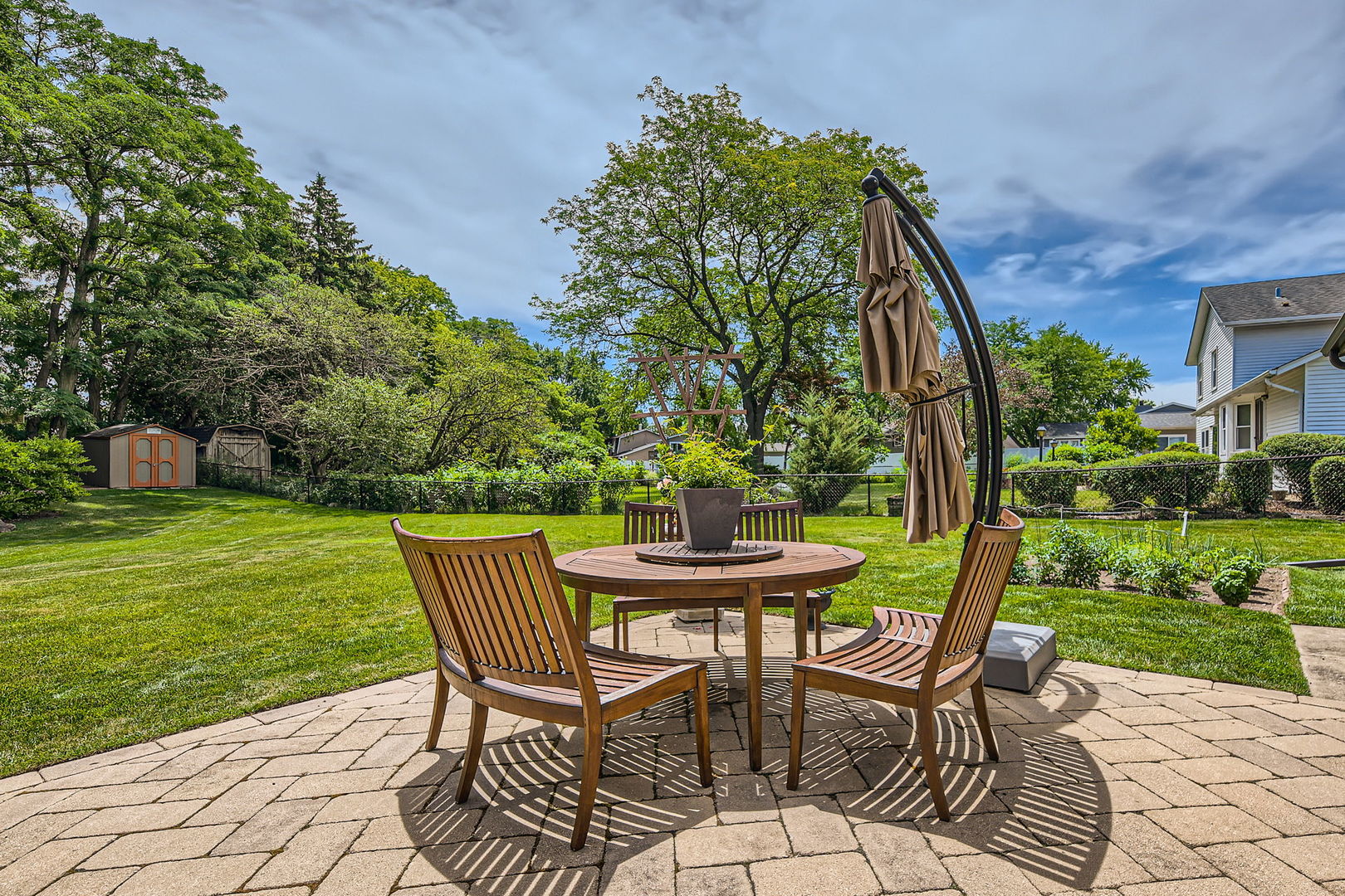 1365 Freeman Road Hoffman Estates, IL 60192 - Photo 31 of 49 a patio with a yard table and chairs