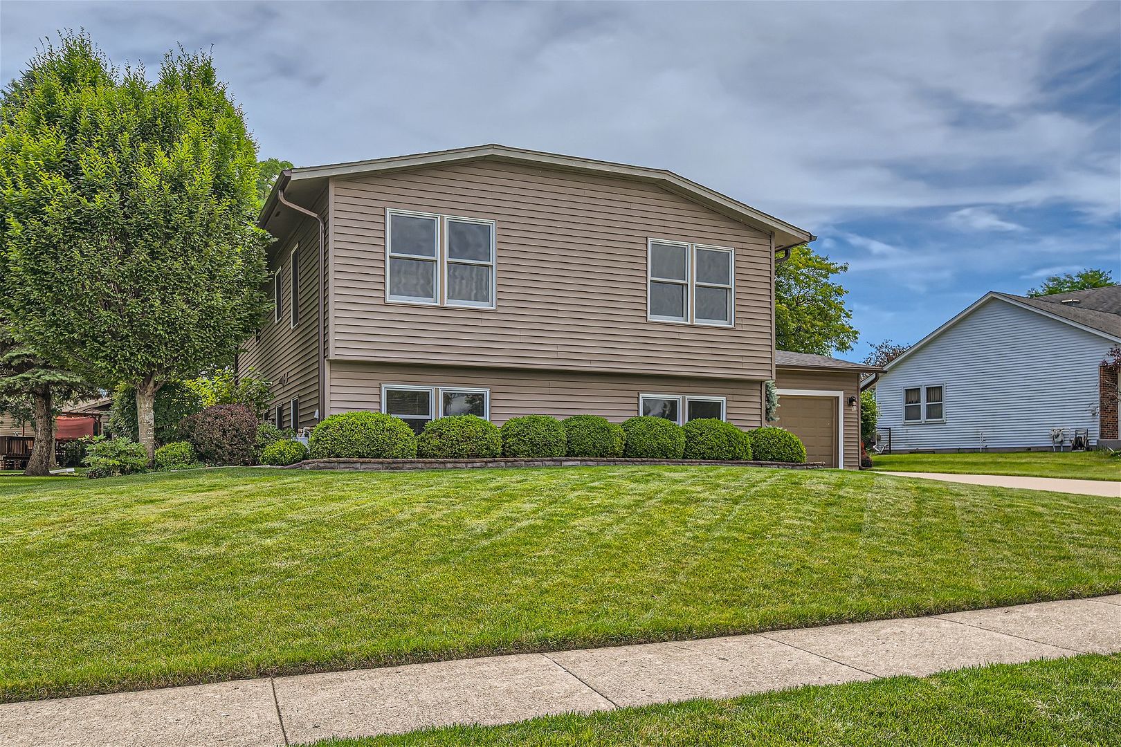 1365 Freeman Road Hoffman Estates, IL 60192 - Photo 37 of 49 a front view of a house with a yard