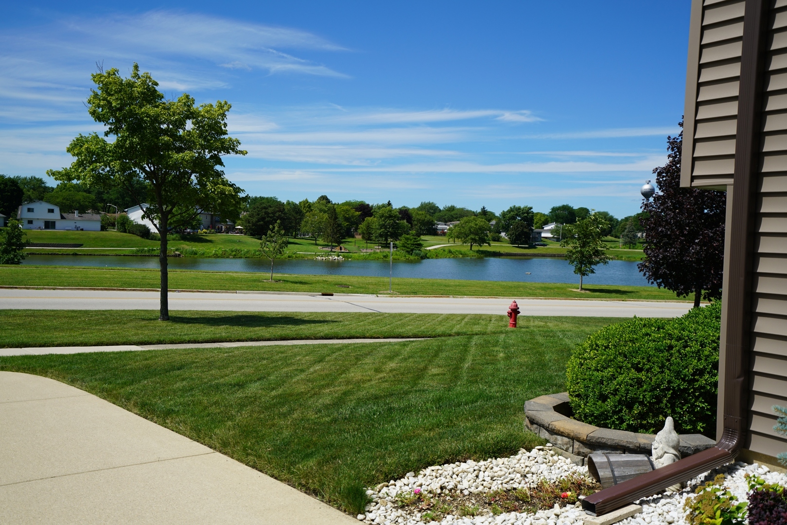1365 Freeman Road Hoffman Estates, IL 60192 - Photo 38 of 49 a view of a golf course with a lake