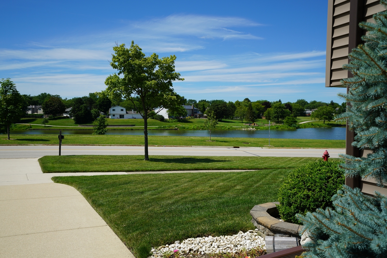 1365 Freeman Road Hoffman Estates, IL 60192 - Photo 39 of 49 a view of a golf course with a lake