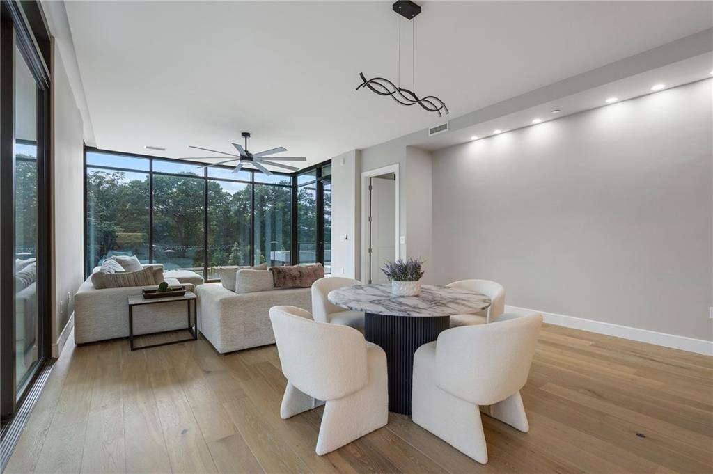 2520 Peachtree Road Northwest, Unit 403 Atlanta, GA 30305 - Photo 11 of 52 a living room with furniture and a large window