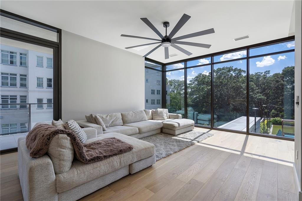 2520 Peachtree Road Northwest, Unit 403 Atlanta, GA 30305 - Photo 18 of 52 a living room with furniture and a large window