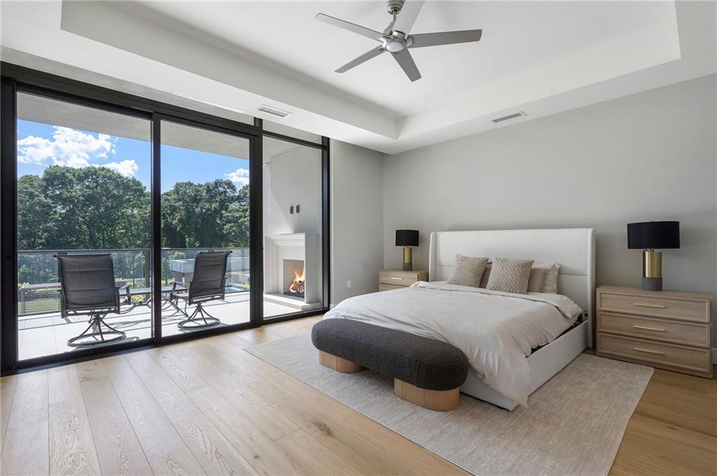 2520 Peachtree Road Northwest, Unit 403 Atlanta, GA 30305 - Photo 22 of 52 a bedroom with a large bed and a balcony view