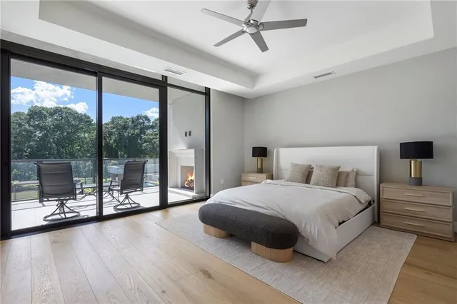 a bedroom with a bed and a ceiling fan