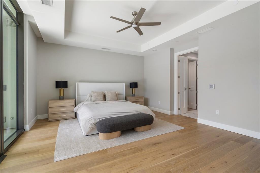 2520 Peachtree Road Northwest, Unit 403 Atlanta, GA 30305 - Photo 24 of 52 a bedroom with a bed and a ceiling fan