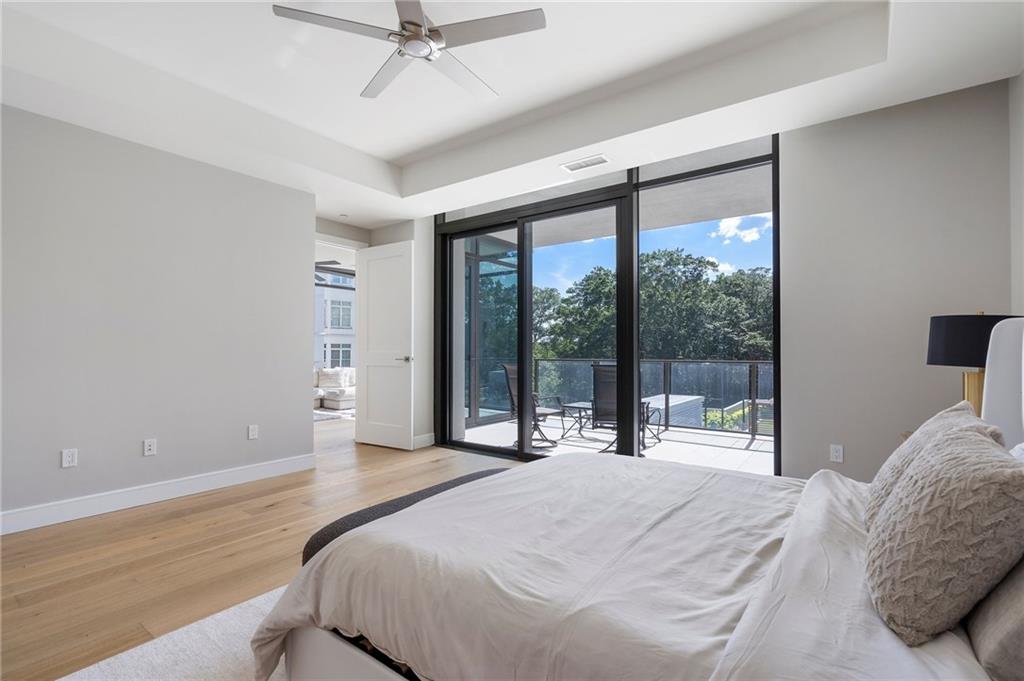 2520 Peachtree Road Northwest, Unit 403 Atlanta, GA 30305 - Photo 25 of 52 a bedroom with a bed and a large window