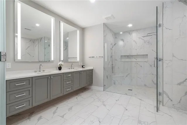 a bathroom with a bathtub and a shower