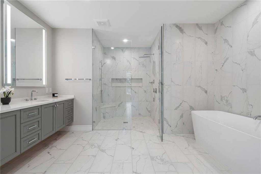 2520 Peachtree Road Northwest, Unit 403 Atlanta, GA 30305 - Photo 28 of 52 a bathroom with a double vanity sink toilet and shower