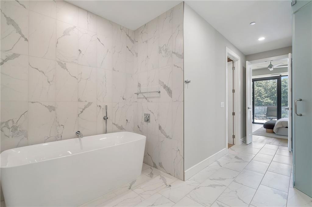 2520 Peachtree Road Northwest, Unit 403 Atlanta, GA 30305 - Photo 30 of 52 a bathroom with a bathtub and a shower