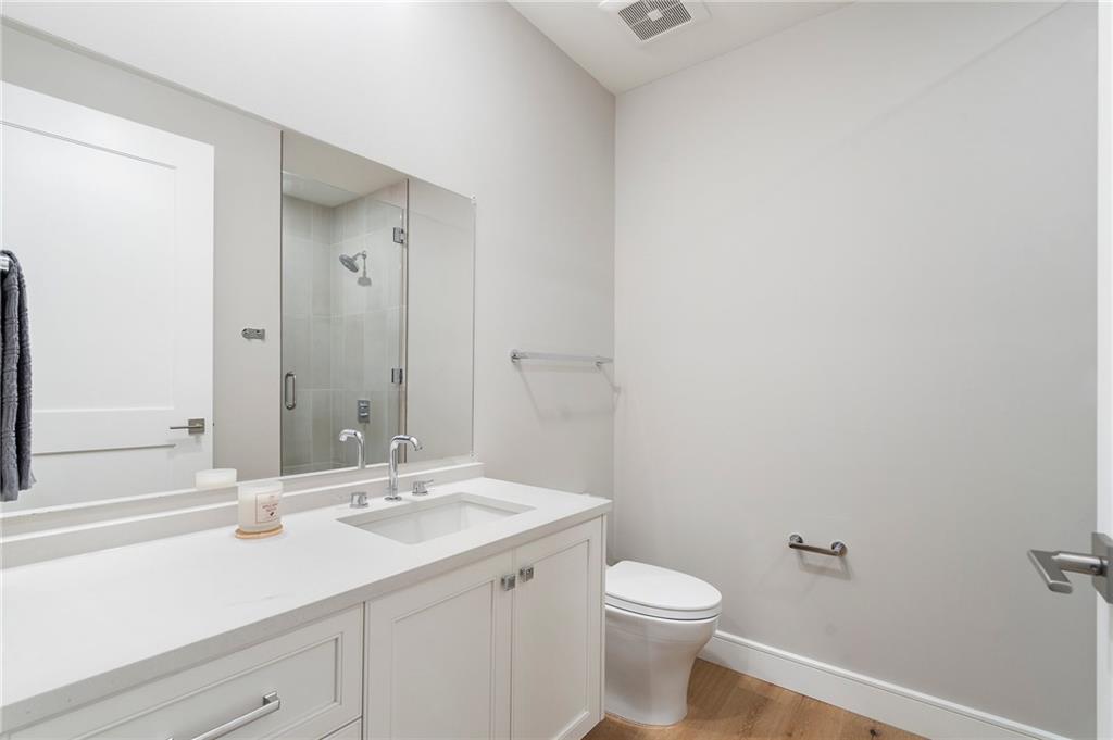 2520 Peachtree Road Northwest, Unit 403 Atlanta, GA 30305 - Photo 35 of 52 a bathroom with a sink and a mirror