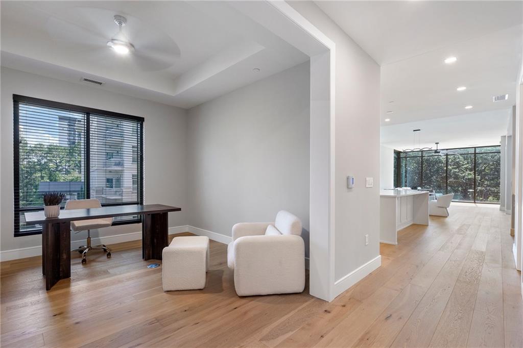 2520 Peachtree Road Northwest, Unit 403 Atlanta, GA 30305 - Photo 35 of 52 a view of a room with dining room and wooden floor
