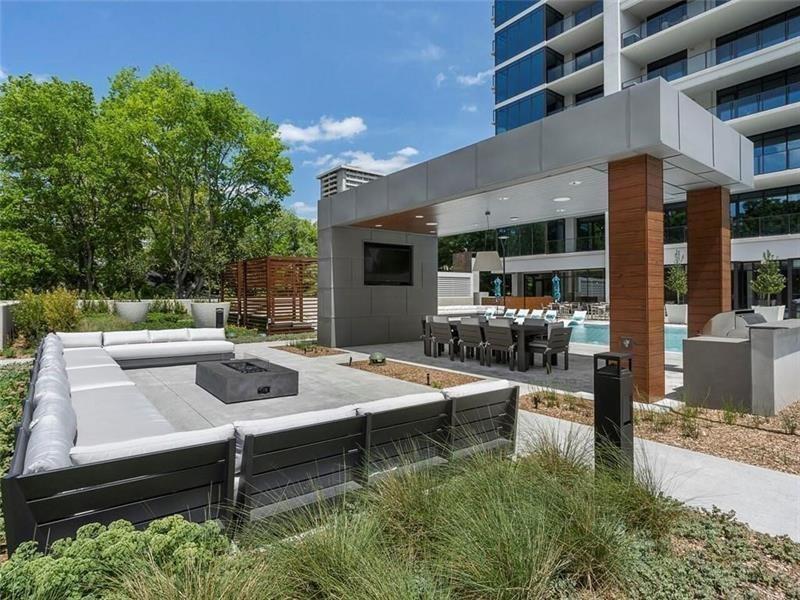 2520 Peachtree Road Northwest, Unit 403 Atlanta, GA 30305 - Photo 42 of 52 a view of a patio with table and chairs and potted plants