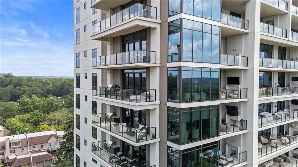 2520 Peachtree Road Northwest, Unit 403 Atlanta, GA 30305 - Photo 52 of 52 a tall building with a large window and palm tree