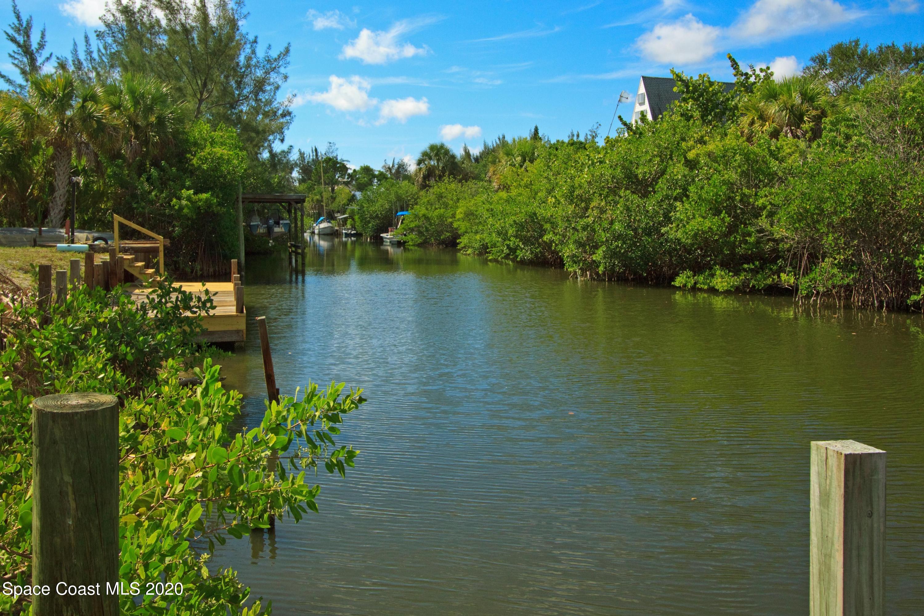 48 Vip Island, Unit B Grant, FL 32949 - Photo 3 of 9 a view of a lake with a mountain in the background