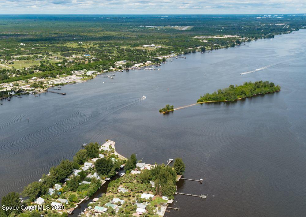 48 Vip Island, Unit B Grant, FL 32949 - Photo 6 of 9 a view of a lake with a mountain