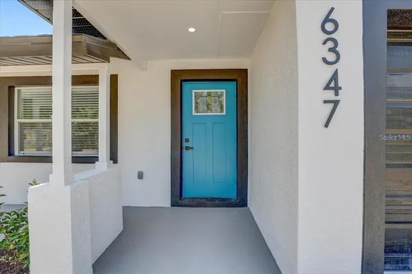 front view of a house with a small yard