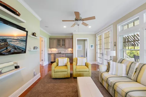 a living room with furniture and a flat screen tv