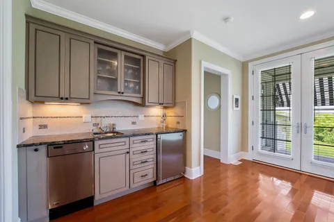 a kitchen with stainless steel appliances granite countertop a stove and a sink