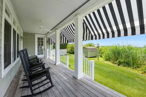 a view of a bench in wooden floor