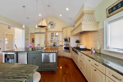 a kitchen with lots of counter top space and appliances