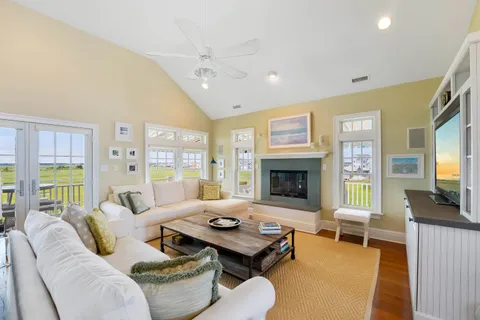 a living room with furniture fireplace and flat screen tv