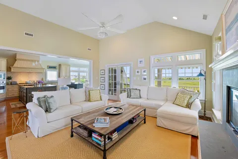 a living room with furniture and a table