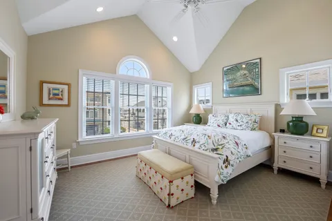 a bed room with a bed and a window