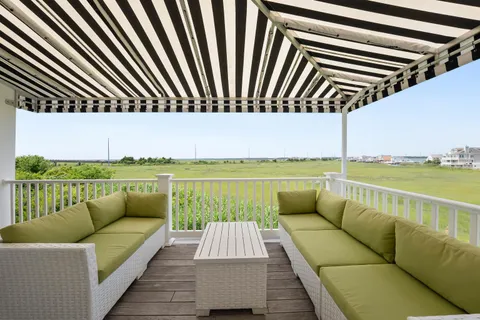 a balcony with furniture