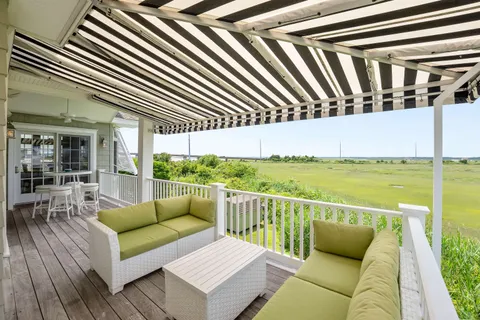 a spacious bedroom with a bed and large window